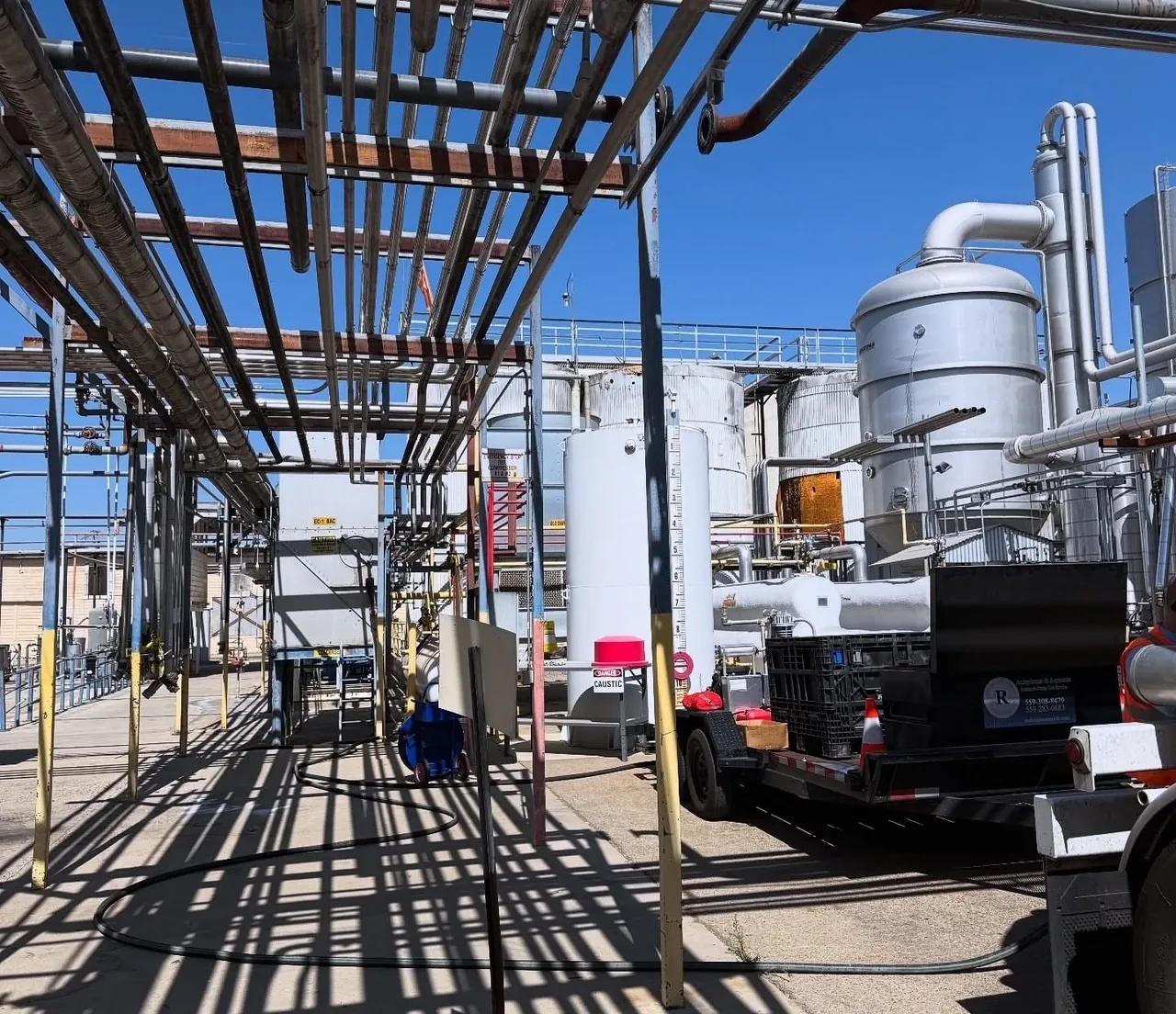 REST LLC trailer with pumping equipment connected at an outdoor ammonia plant rack