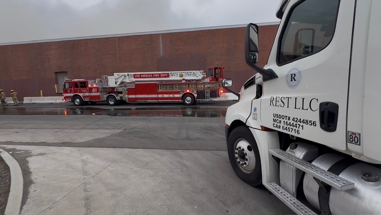 REST LLC tanker staged alongside a Los Angeles Fire Department ladder truck