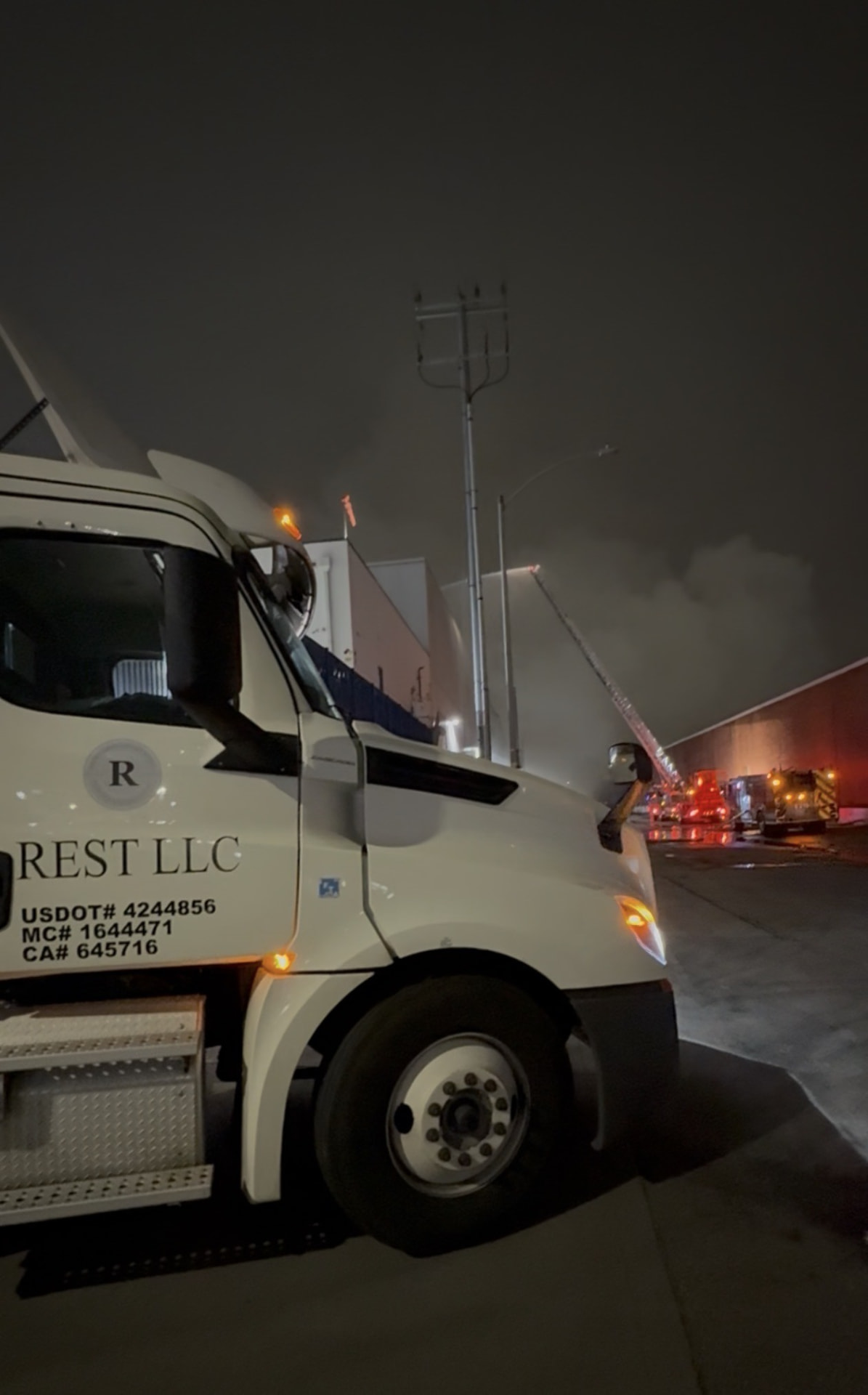 REST LLC tanker working the ammonia incident scene at night under emergency lighting